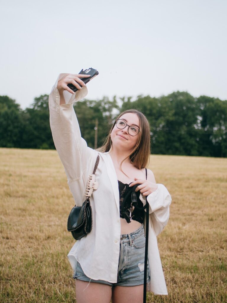 women holding smartphone